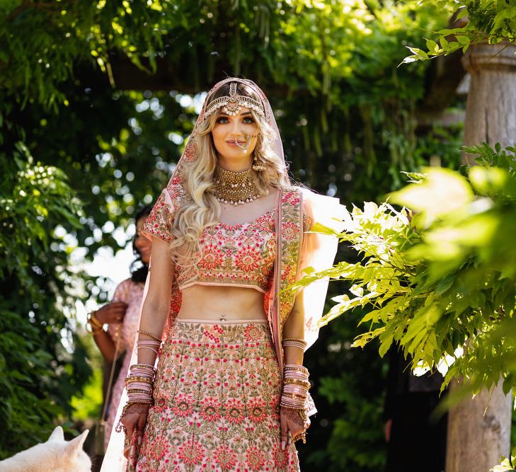 Bride in pink Indian wedding dress