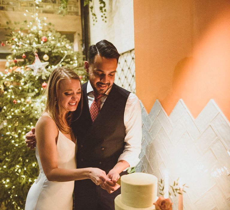 Three tier white wedding cake for a Christmas wedding 