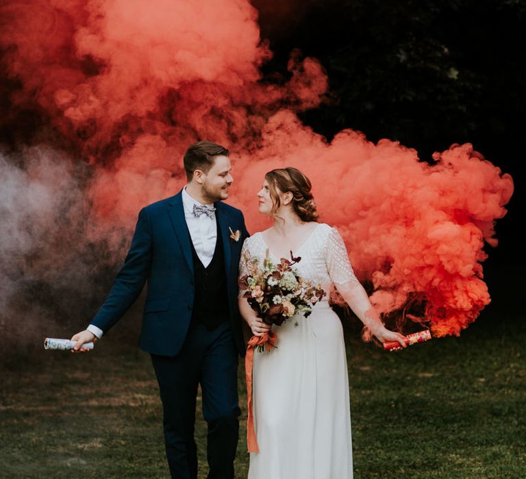 Orange smoke bomb wedding portrait 