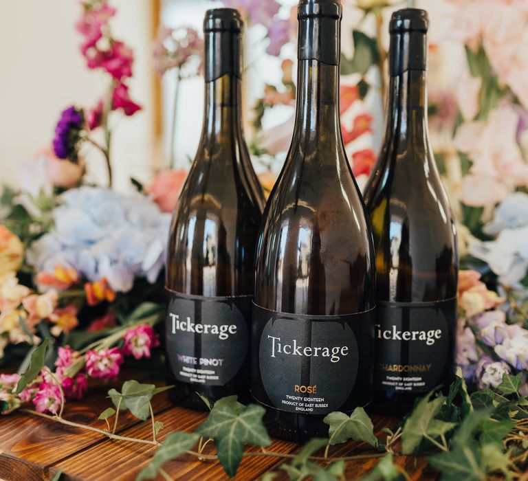 Tickerage wine surrounded by flowers and foliage