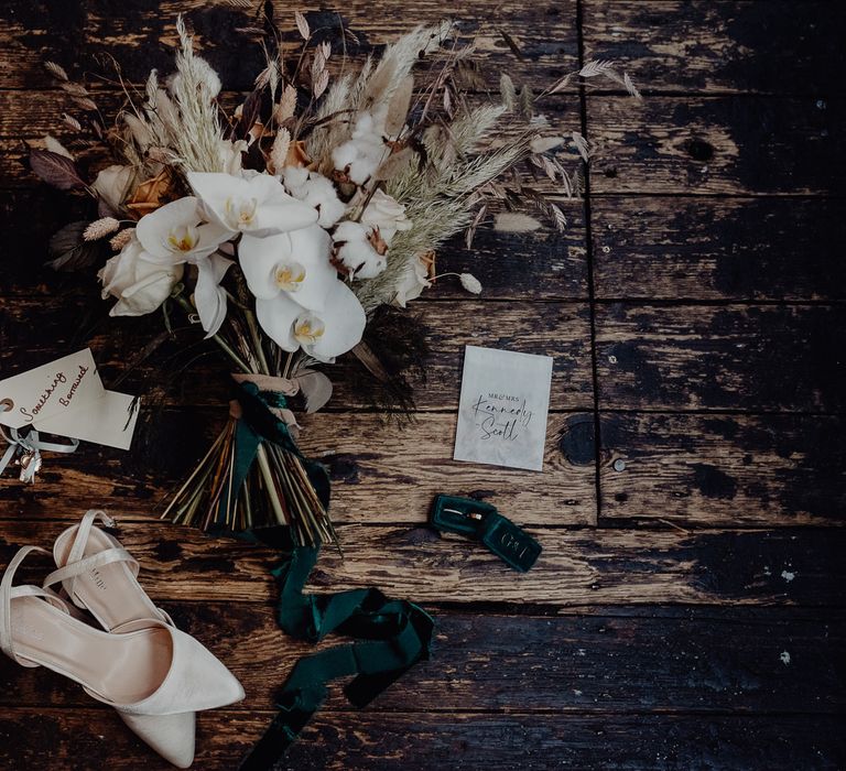 Dried flower and orchid wedding bouquet and bridal accessories