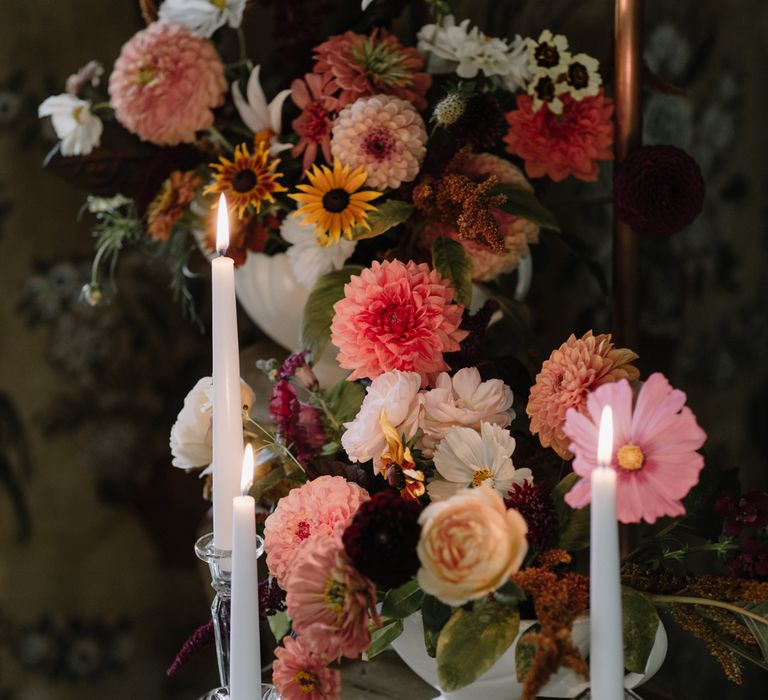 Pink, white and yellow French inspired wedding flowers with white candles