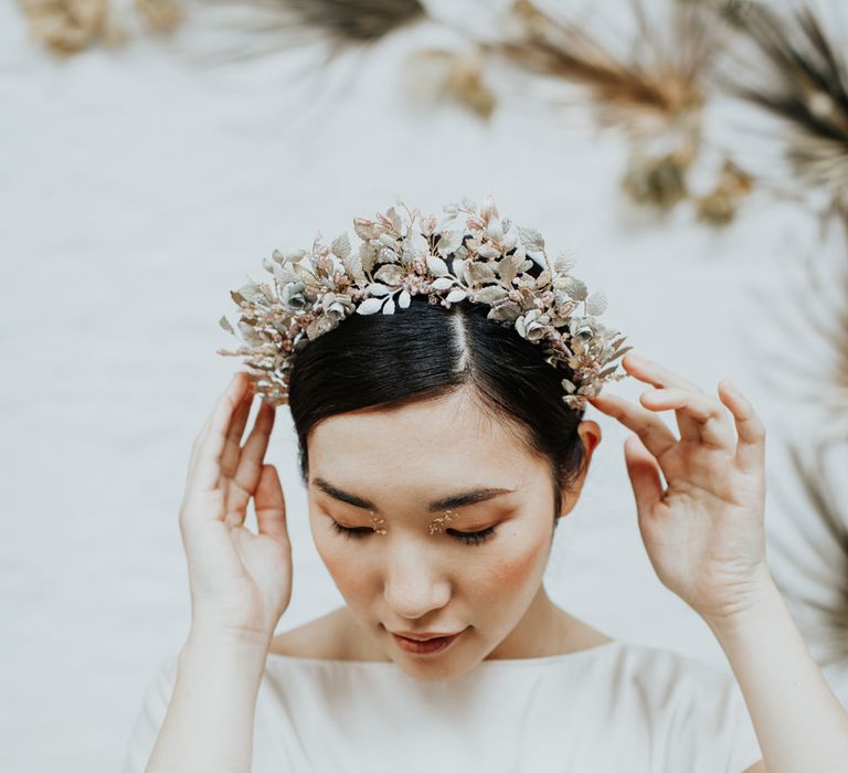 Statement bridal hair accessories for a white and gold wedding theme