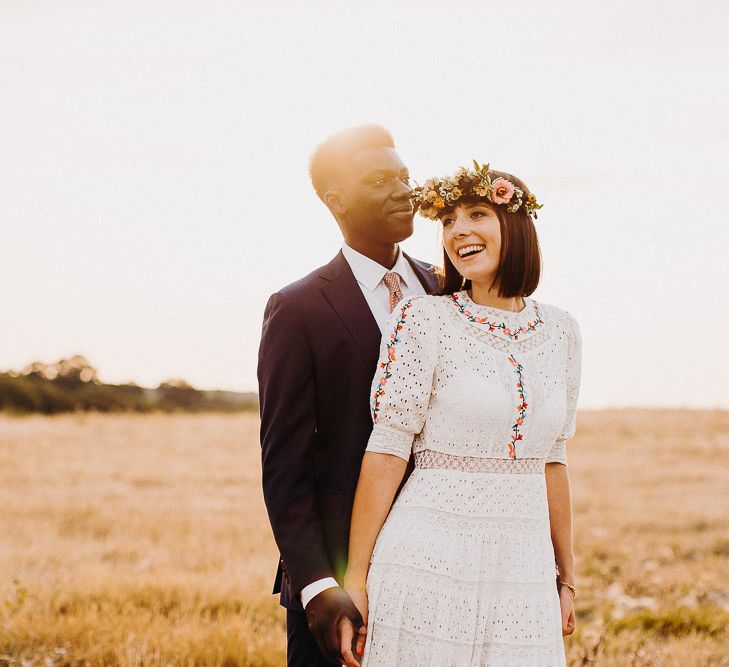 Bride and groom golden hour portraits in a field by Voyteck | London Wedding Photographer 