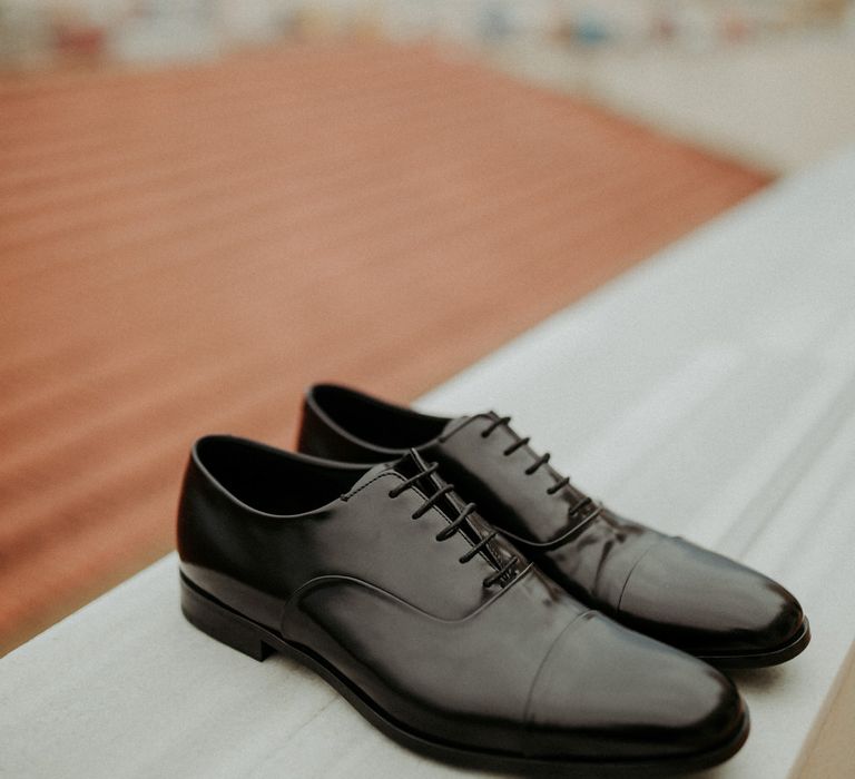 Black Prada wedding shoes for the groom