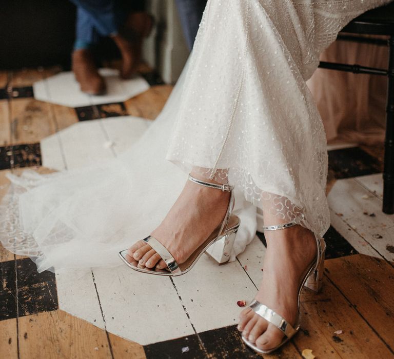 The bride wore shiny silver strappy heels with her sparkly Eliza Jane Howell wedding dress