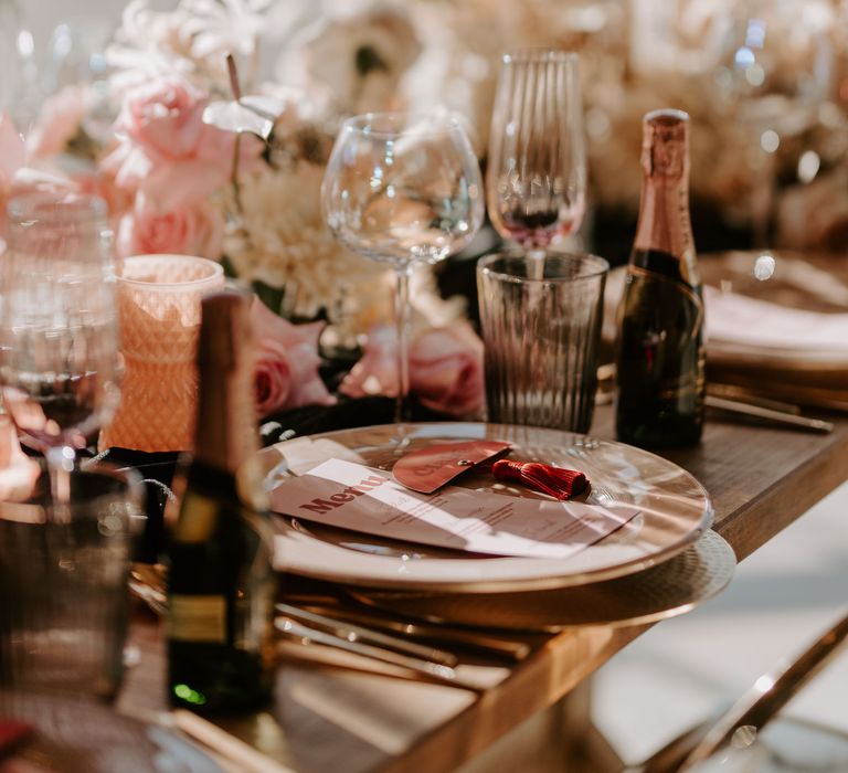 Iridescent table and glassware at intimate tablescape 