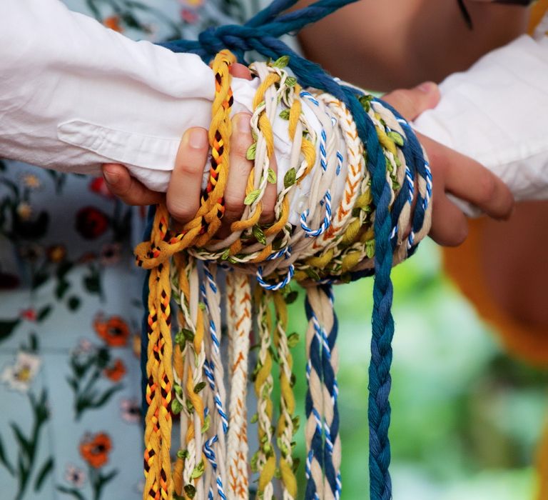 Hand fastening ceremony complete with colourful ropes