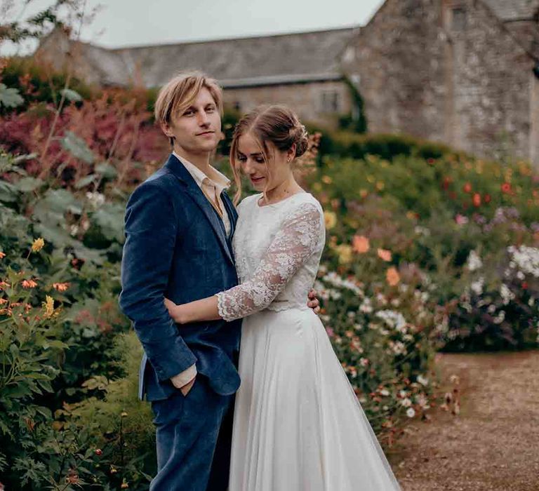 Groom in blue velvet wedding suit at Cadhay House venue