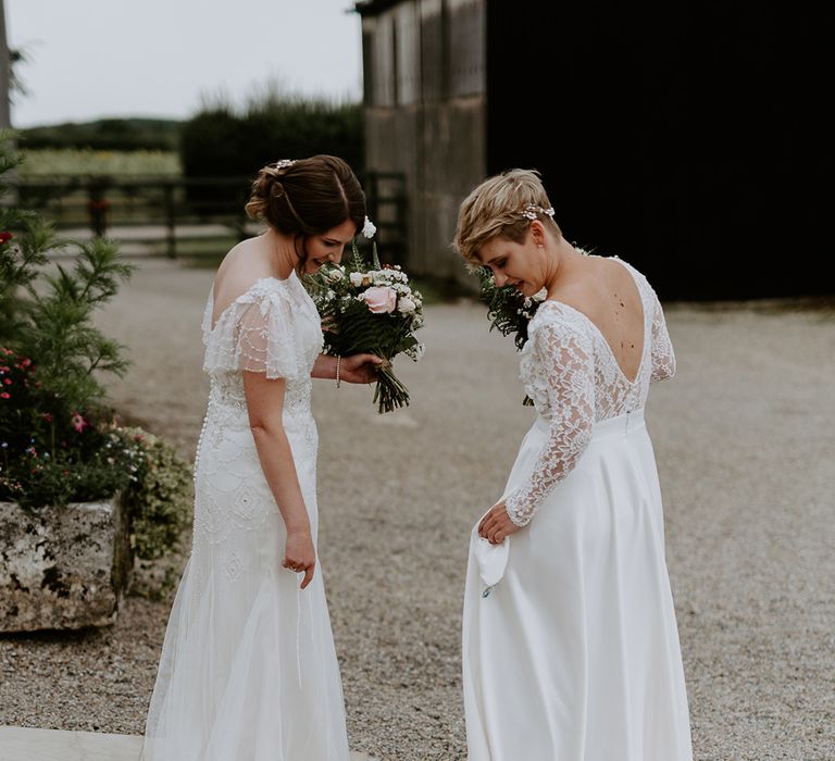 Woolas Barn wedding with two brides in an embellished and long sleeve wedding dress 