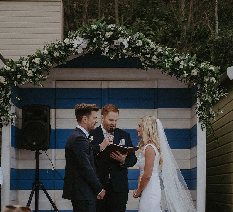 Beach hut wedding ceremony