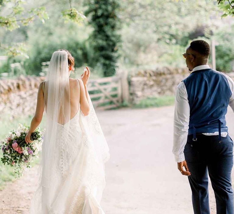 Bride & groom walk together after wedding ceremony