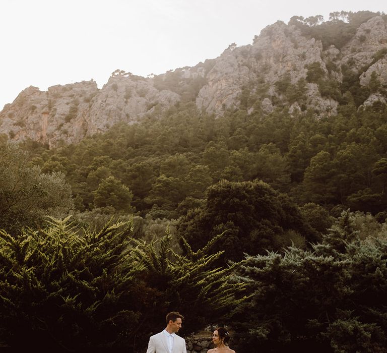 Bride and groom holding hands