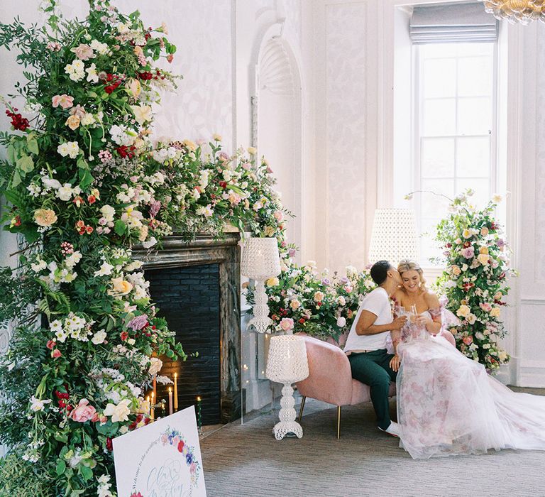 Barnett Hill Hotel wedding inspiration with colourful flower arrangements, bride in a pink wedding dress and lamps 