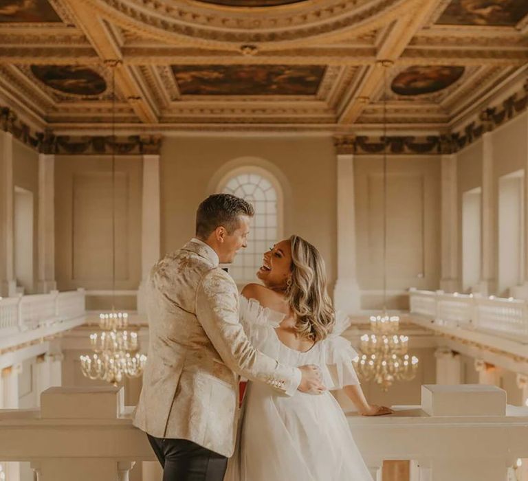 Bride and groom laugh with each other at The Banqueting House wedding venue in London