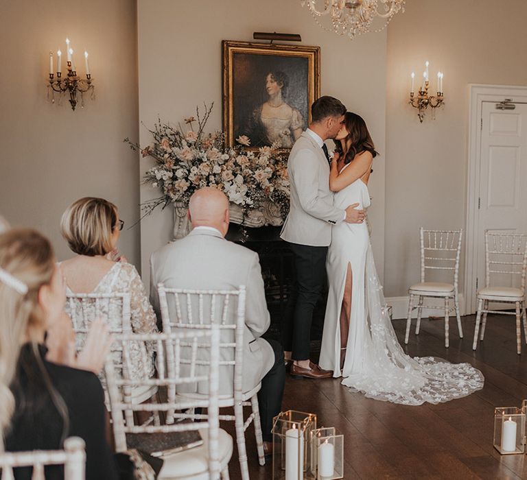 Bride and groom share their first kiss as married couple 