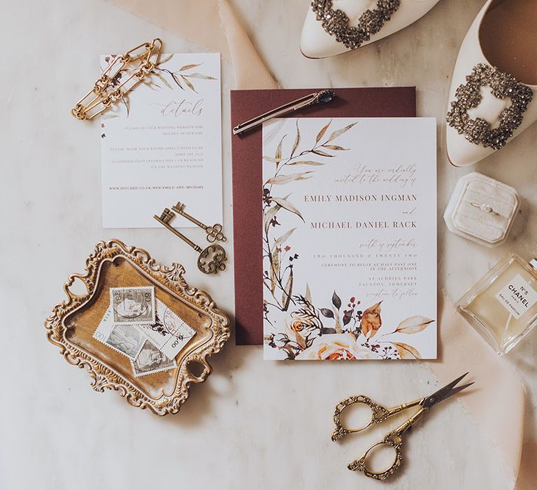 Classic wedding stationery beside Manolo Blahnik bridal shoes and Chanel No.5 perfume