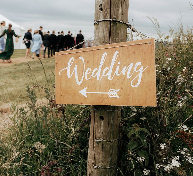 Wooden wedding signage complete with white writing 