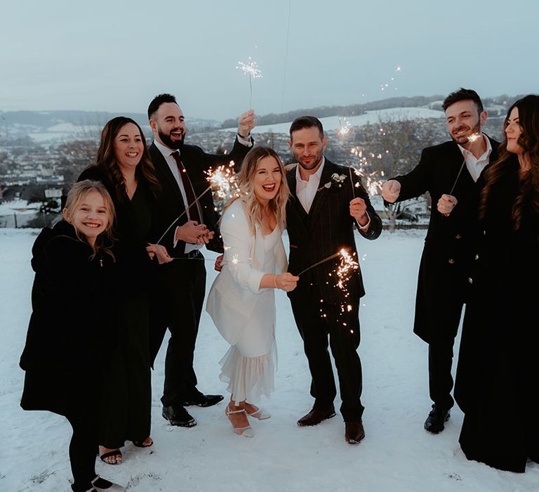 Special sparkler moment for the bride, groom and intimate wedding party as well as their daughter 