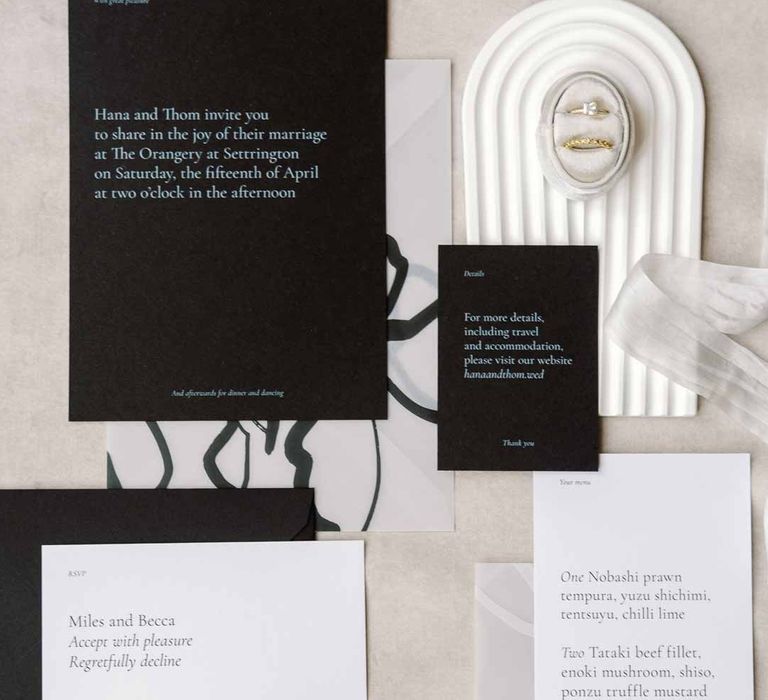 Monochrome minimalist wedding stationery with white tassel earrings at Settrington Orangery 