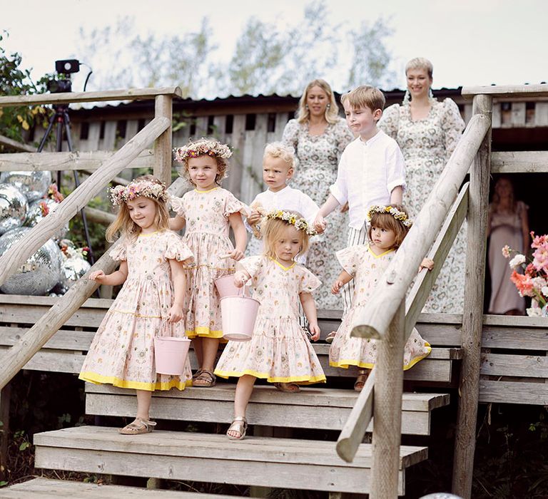 Pink and yellow floral flower girl dresses with bridesmaids in patterned bridesmaid dress 