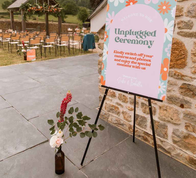 Unplugged wedding ceremony sign with retro flower pattern 