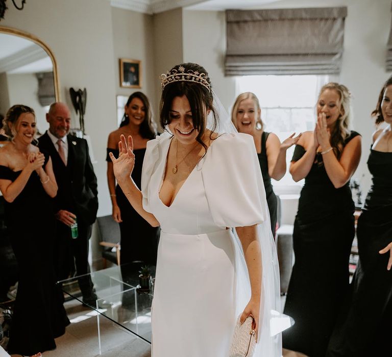 Bride wearing puff sleeve wedding dress and front slit design 