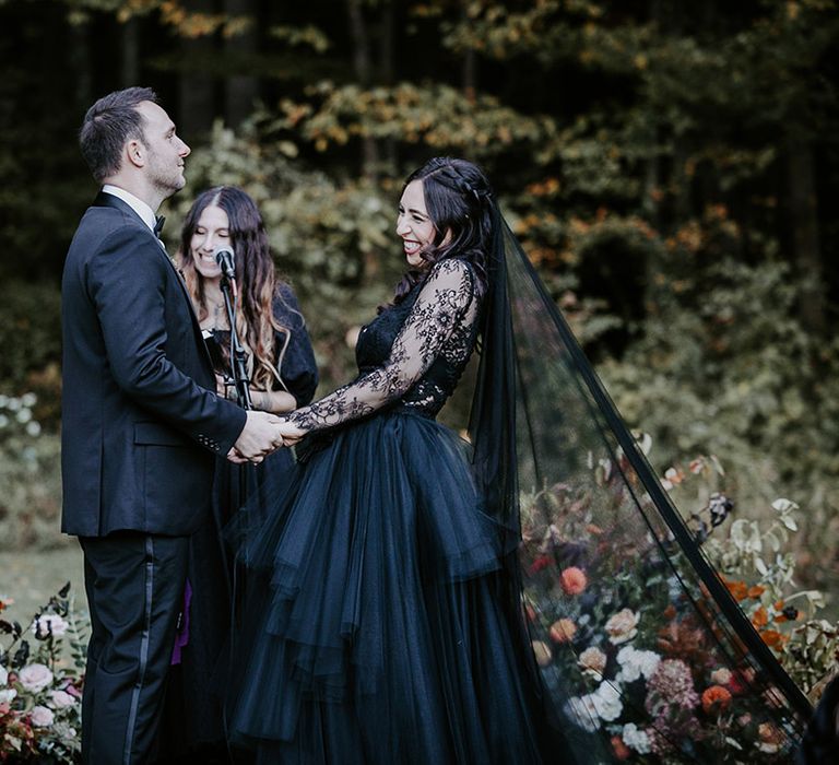 Gothic wedding with Pagan-inspired wedding ceremony with the bride wearing a black wedding dress 