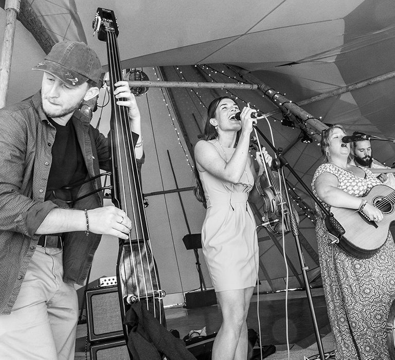 Wedding band plays for the wedding reception in the tipi 