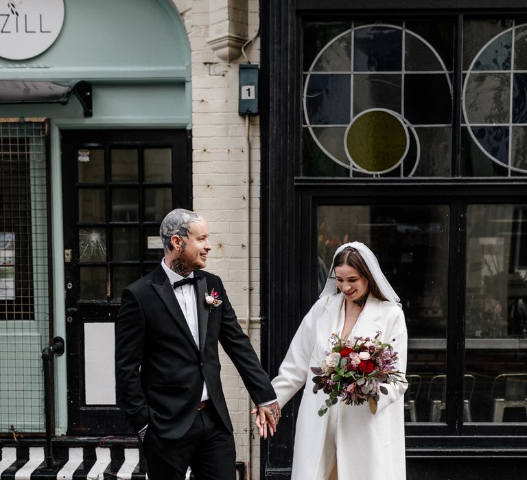 Stylish bride and groom at first look 