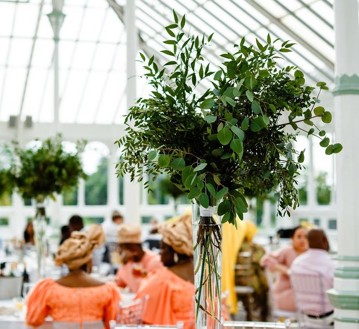 Foliage table centrepieces for a botanical wedding in a glasshouse 