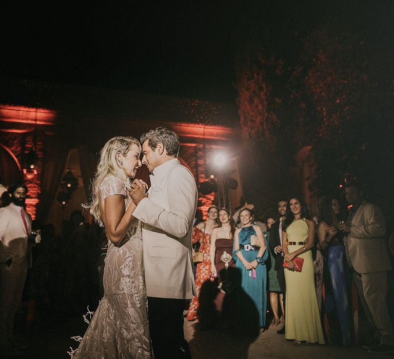 Bride and groom first dance in black tie attire 