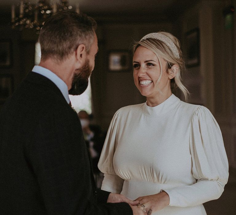 Bride in a highjack wedding dress and bridal headband 