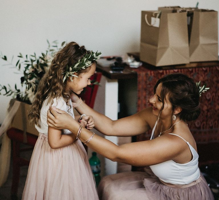 Flower girl wearing olive bouquet headband crown