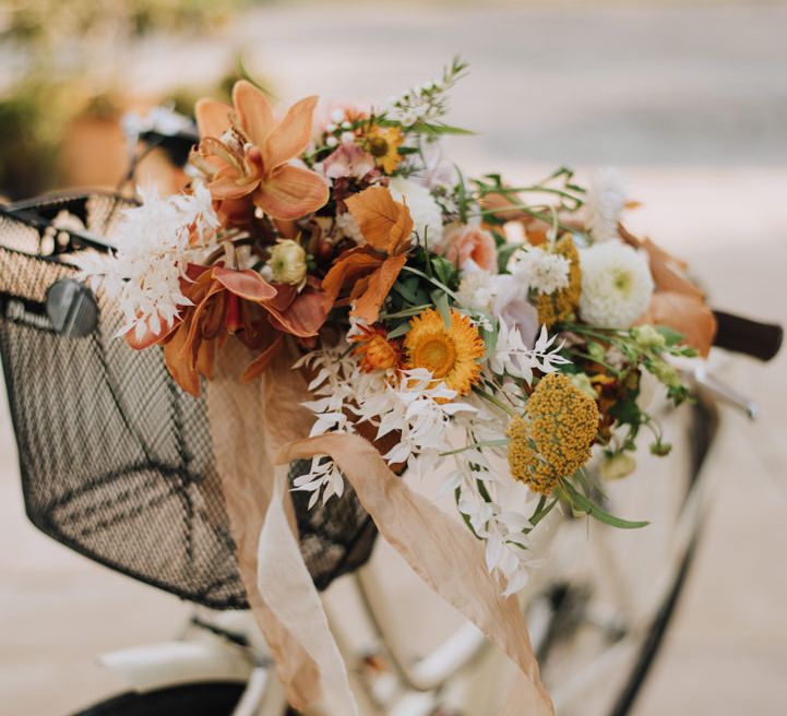 Autumn wedding flower display in a vintage bike basket