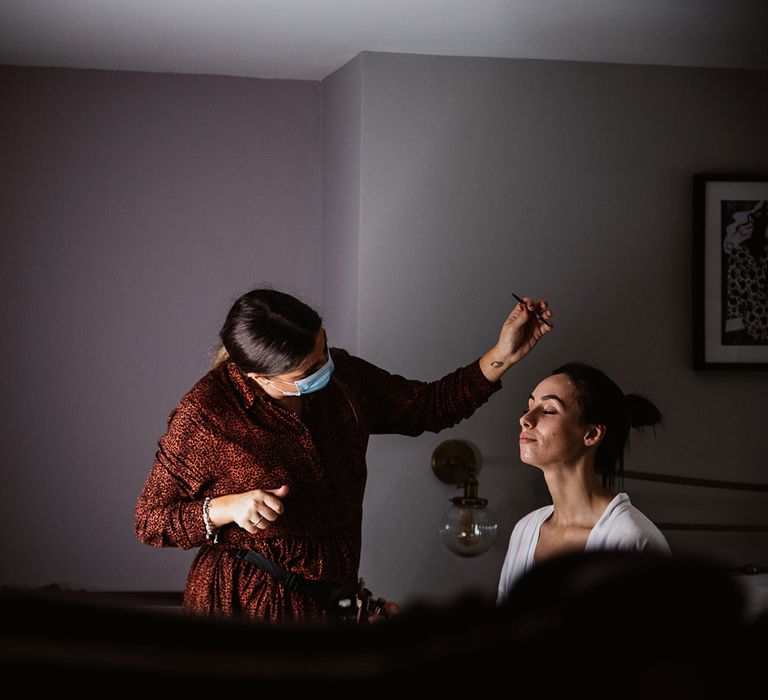 Bride having her make up done