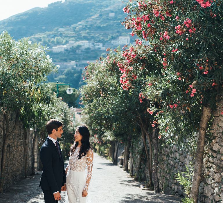 Bride in wedding jumpsuit with long sleeves