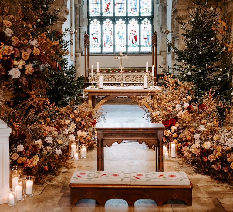 Display of Christmas church wedding flowers at the altar