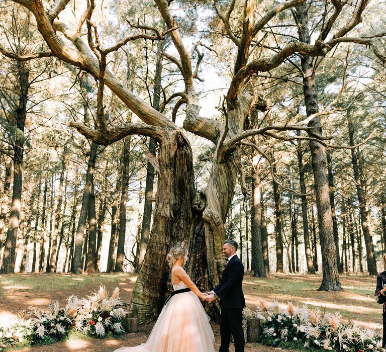 Tulle skirt wedding dress for bride at woodland wedding