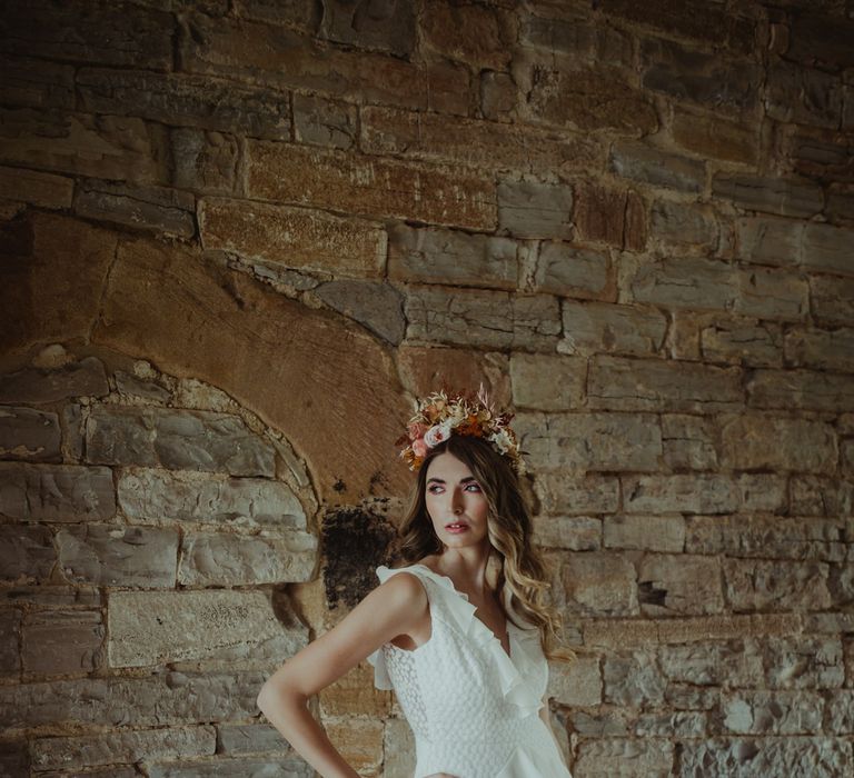 Bride in blush flower crown and ruffle detail wedding dress