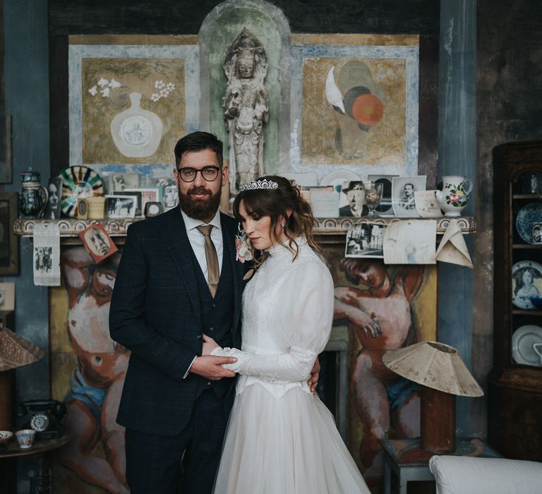 Author Juno Dawson & her husband embrace on their wedding day within the Charleston House