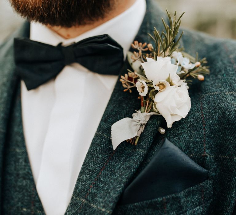 Bow tie and flower buttonhole for groom