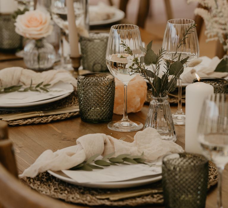 Rustic wedding tablescape on wooden table complete with candles and woven placemats  | Mark Bamforth Photography