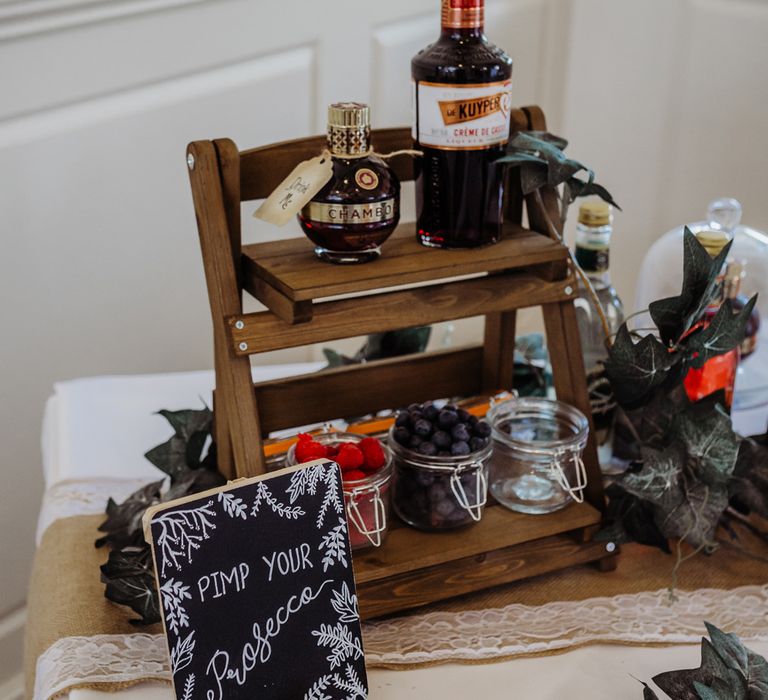 Pimp your Prosecco station for rustic wedding with chalkboard sign, fruits and liqueur