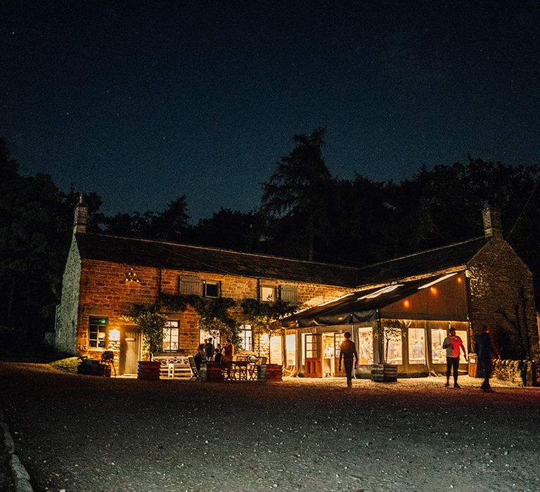 Tipi lit up at night outdoors