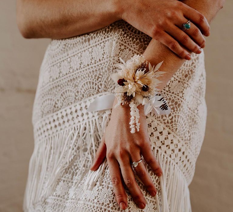 Lace Shikoba Bride wedding dress and dried flower wrist corsage by Luna And Wild 