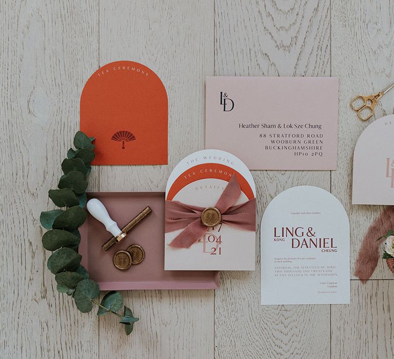 modern wedding stationery suite in blush pinks and oranges 