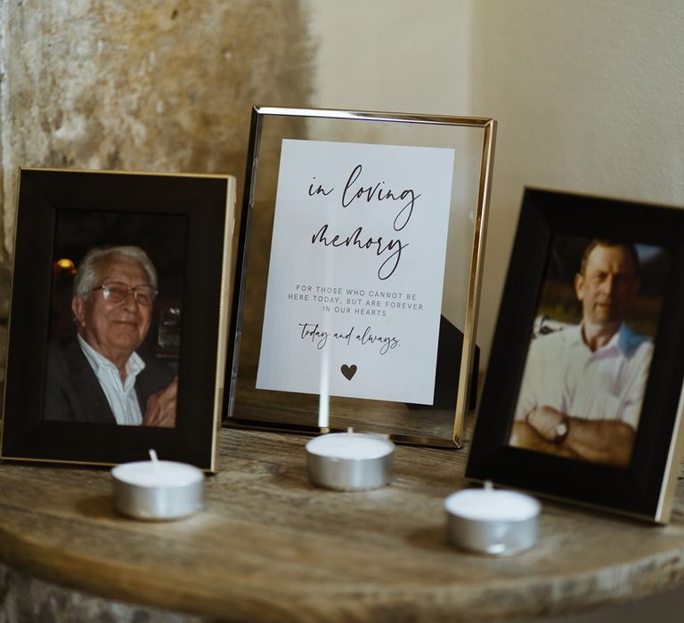 Tealights and photos of family members set up for those lost 