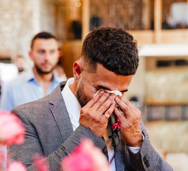 Groom becomes emotional as his bride walks down the aisle at Priston Mill on their wedding day