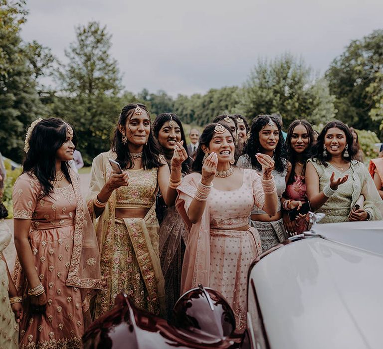 Wedding guests wear colourful outfits during Hindu and Sri Lankan wedding 